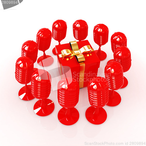 Image of microphones around gift box