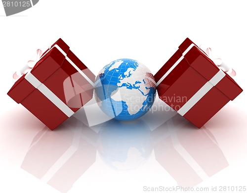Image of Traditional Christmas gifts and earth. Global holiday concept 