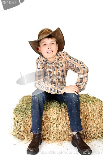 Image of Boy chewing on a piece of straw