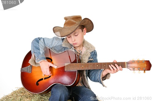 Image of Boy strumming guitar