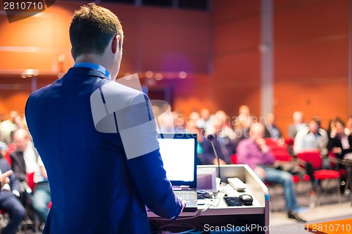 Image of Speaker at Business Conference and Presentation.