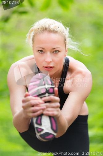 Image of Lady practicing yoga in the nature.