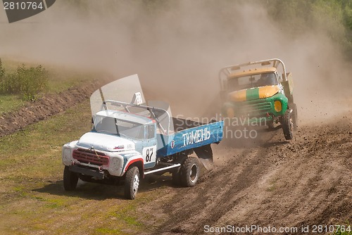 Image of Sport trucks racing on unpaved track