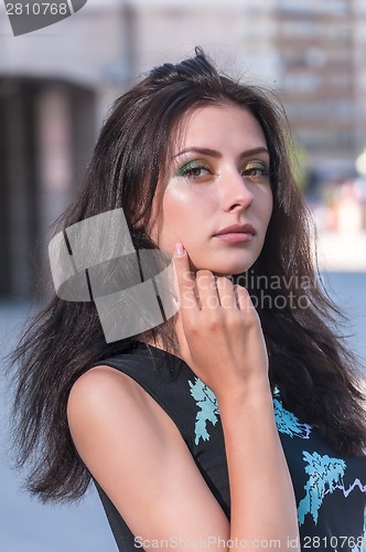 Image of Attractive young girl in dress