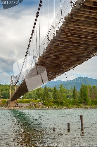 Image of old suspension bridge through Katun