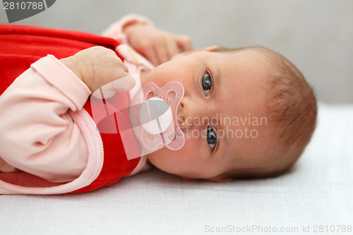 Image of baby in red dress