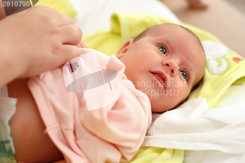 Image of dressing baby after bath