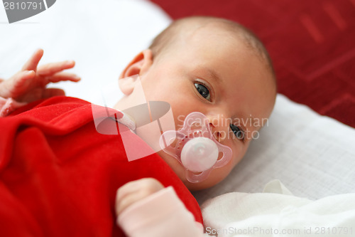 Image of baby in red dress