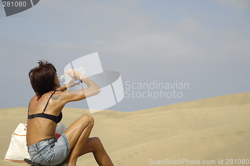 Image of Woman, water and desert