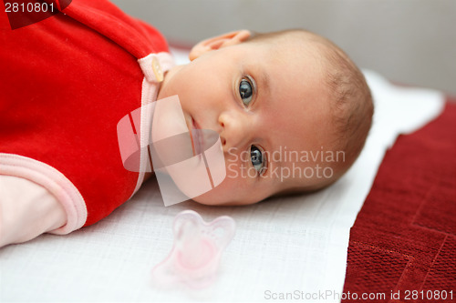 Image of baby in red dress