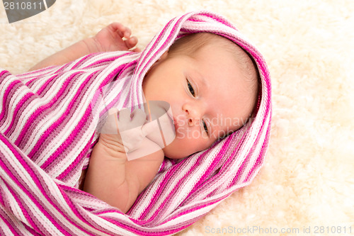 Image of smiling newborn baby