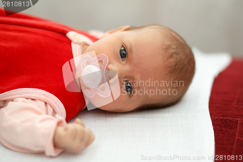 Image of baby in red dress