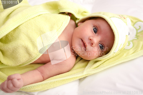 Image of infant wrapped in a towel after bath