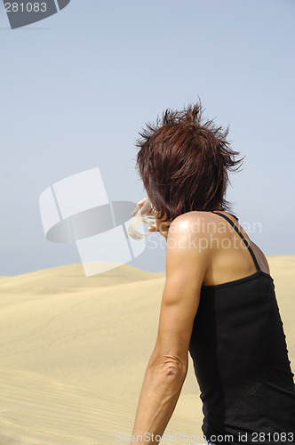 Image of Woman, water and desert