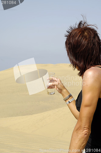 Image of Woman, water and desert