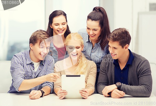 Image of smiling students with tablet pc at school