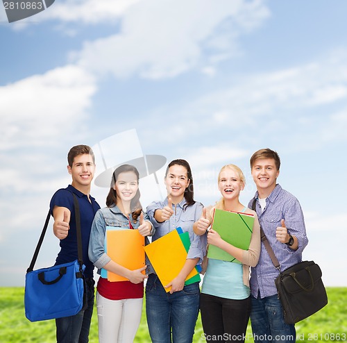 Image of group of smiling students showing thumbs up