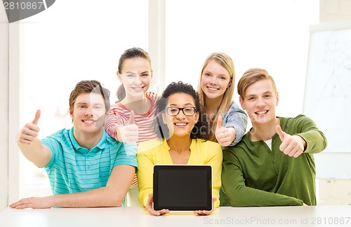 Image of smiling students showing tablet pc blank screen