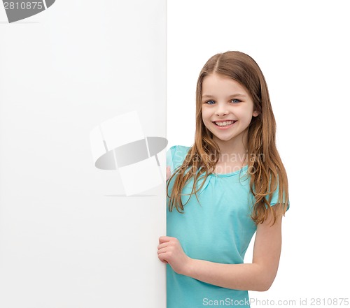 Image of happy little girl with blank white board