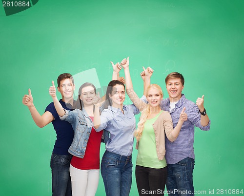 Image of group of smiling students showing thumbs up