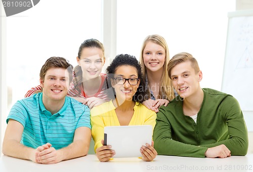 Image of smiling students with tablet pc computer at school