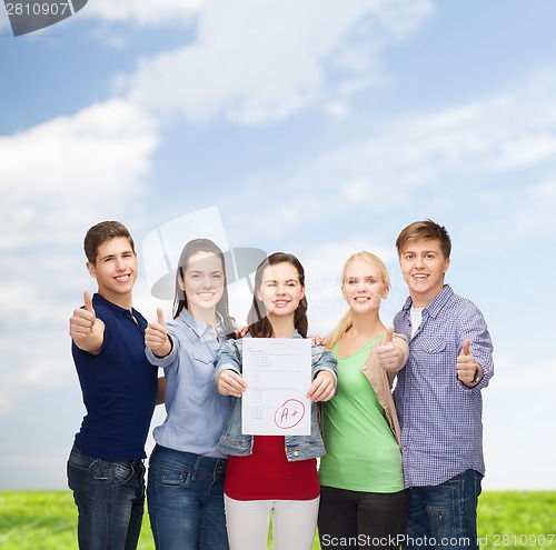 Image of group of students showing test and thumbs up