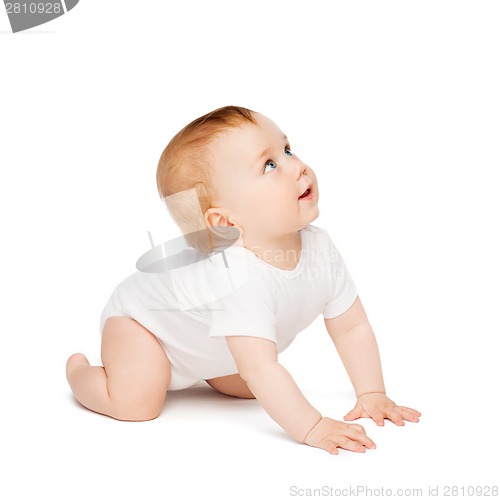 Image of crawling curious baby looking up