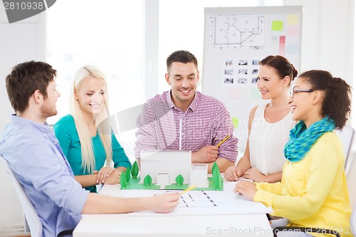 Image of smiling architects working in office