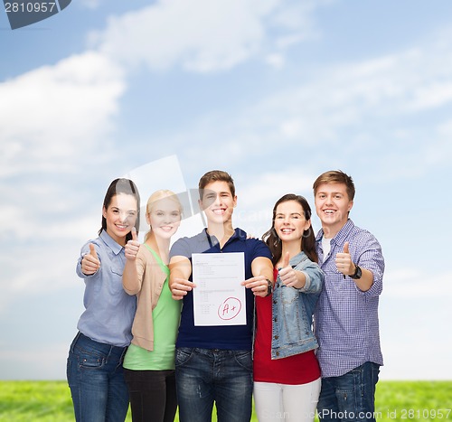 Image of group of students showing test and thumbs up