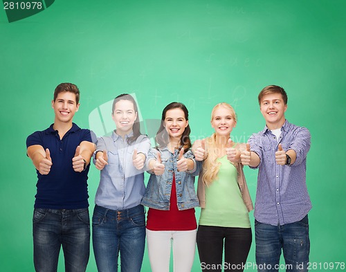 Image of group of smiling students showing thumbs up