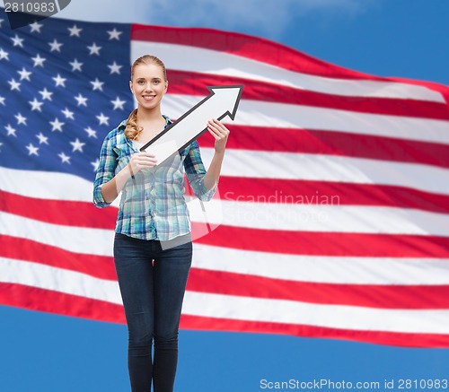 Image of smiling young woman with arrow poiting up