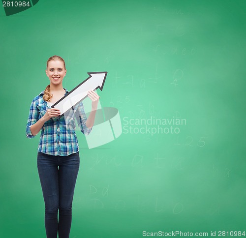 Image of smiling young woman with arrow poiting up