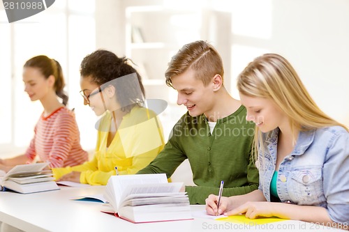 Image of students with textbooks and books at school