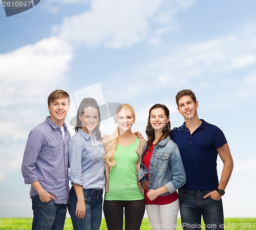 Image of group of standing smiling students