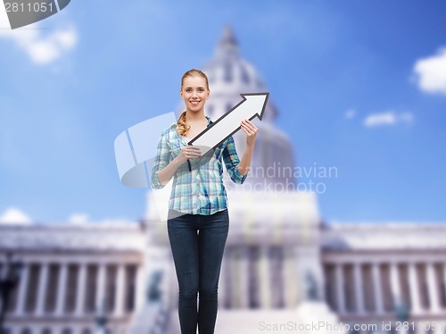 Image of smiling young woman with arrow poiting up