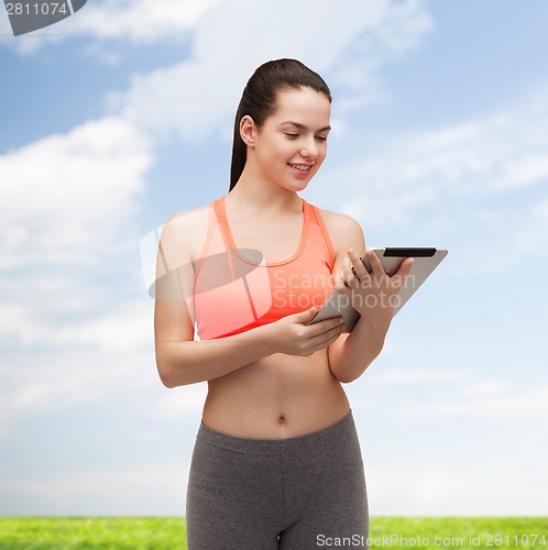 Image of sporty woman with tablet pc computer