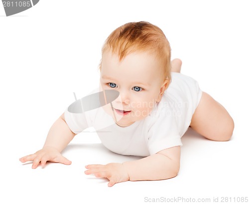 Image of smiling baby lying on floor