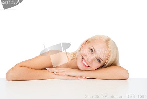 Image of clean face and shoulders of beautiful young woman