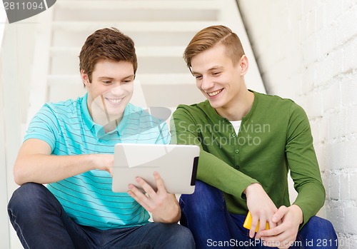 Image of smiling male students with tablet pc computer