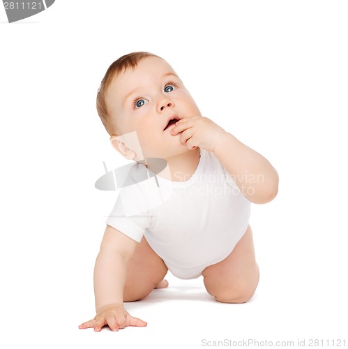 Image of crawling curious baby looking up