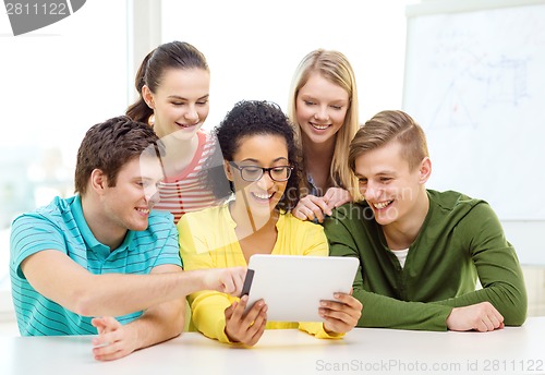 Image of smiling students with tablet pc computer at school