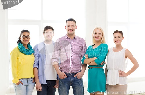 Image of happy creative team in office