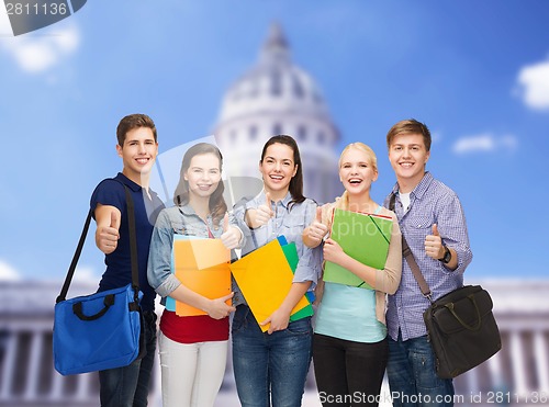 Image of group of smiling students showing thumbs up