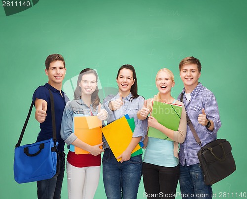 Image of group of smiling students showing thumbs up