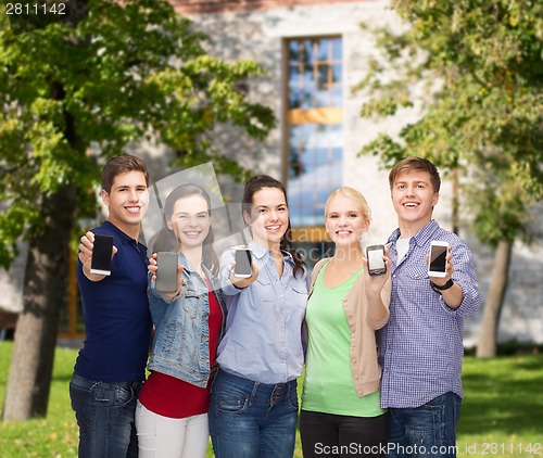 Image of students showing blank smartphones screens