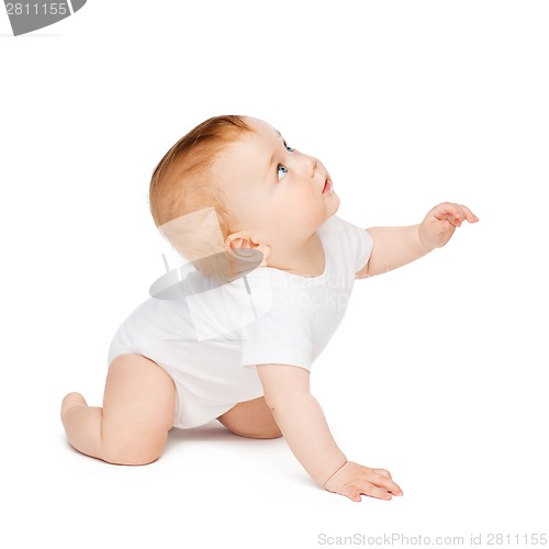 Image of crawling curious baby looking up