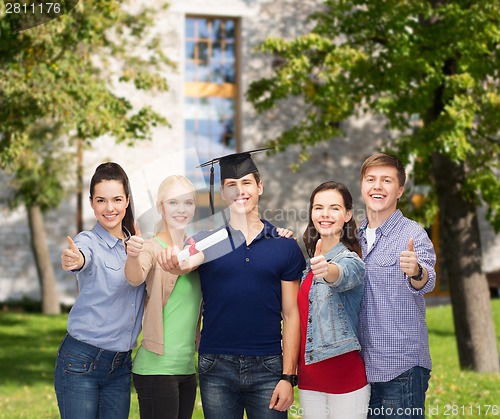 Image of group of students with diploma showing thumbs up