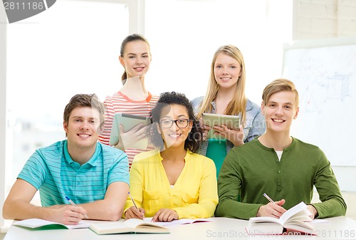 Image of students with textbooks and books at school