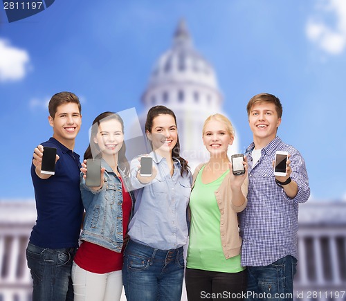 Image of students showing blank smartphones screens