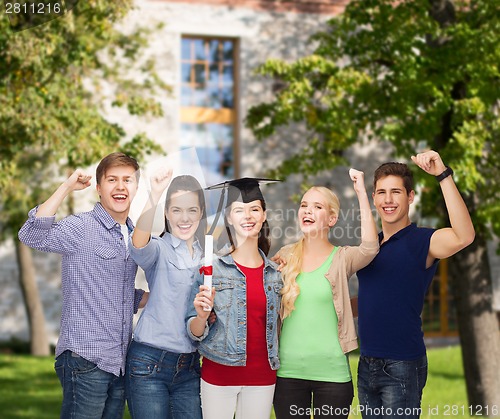 Image of group of standing smiling students with diploma